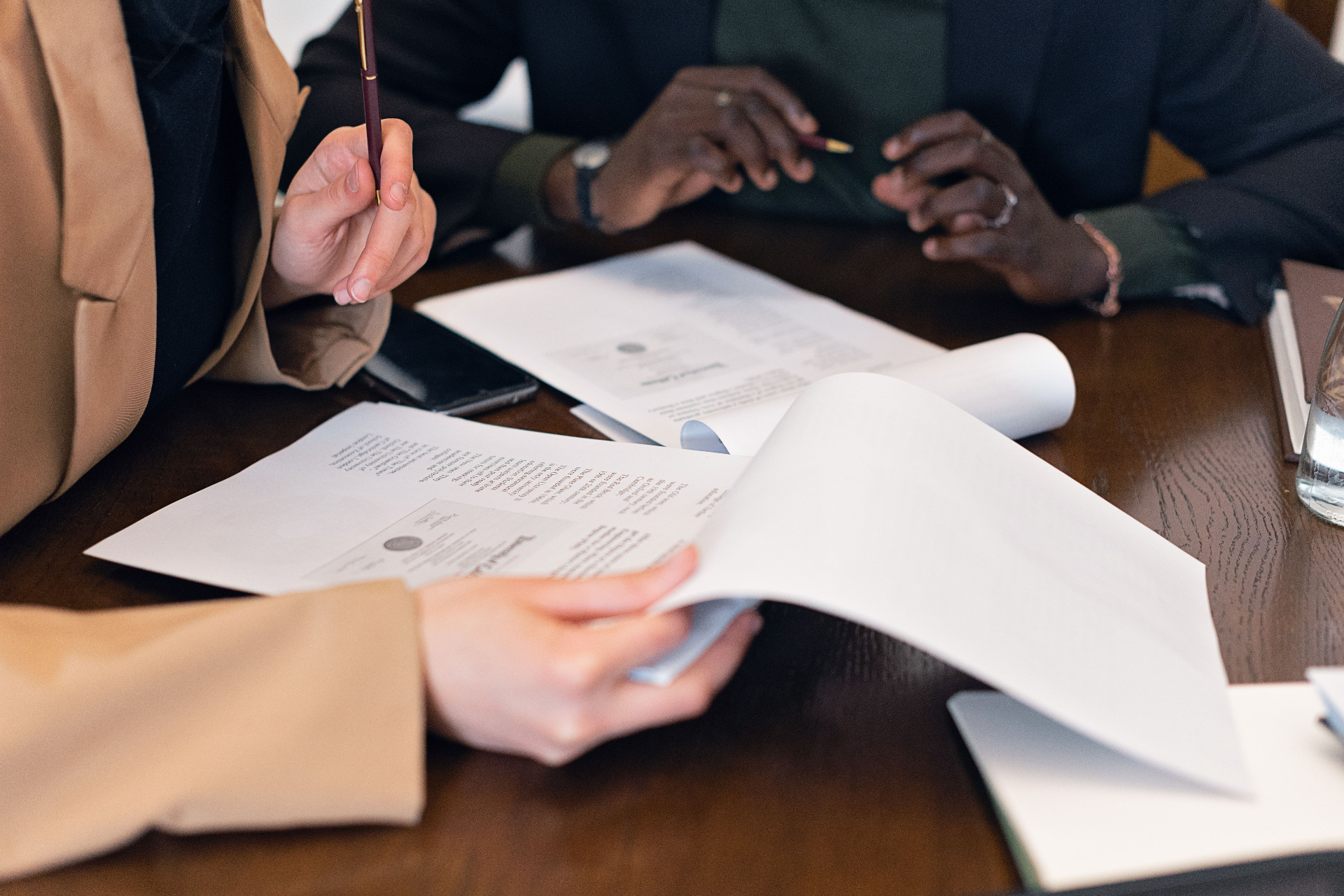 Consultants reviewing travel documents